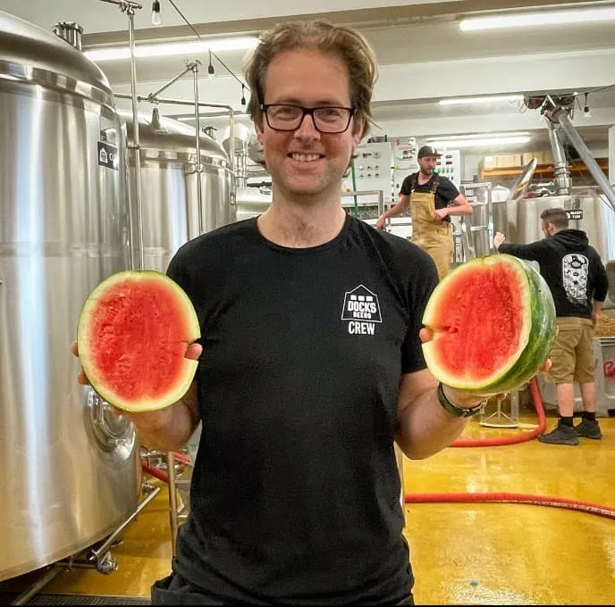 Docks beers team member holding watermelon